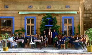 Kafanska bašta na trotoaru sa lijanderima